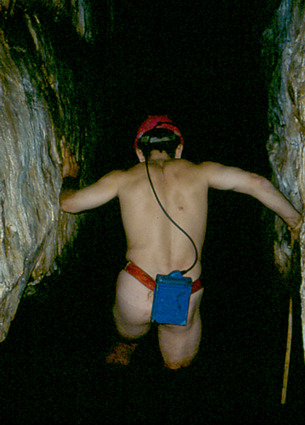 Peter Swart exploring across sesspool in Guano cave Otter tr