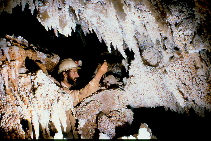 Apple Green surveying stream passage under Krakatoa Cango 3 