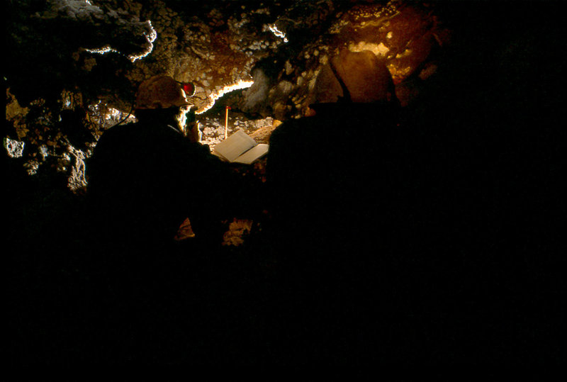 Dave Crombie surveying in stream passage below Krakatoa Cang