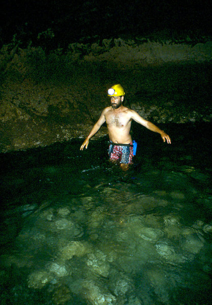 Anthony Hitchcock wading along Klasies RIver Mouth sea tunnel